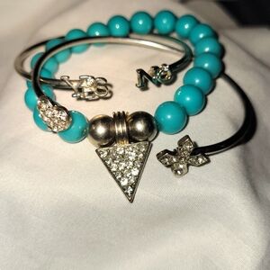Teal Blue Beaded Bracelet, with two delicate sterling silver bands and charms.